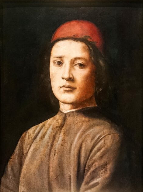 cuadro de joven con casquete rojo